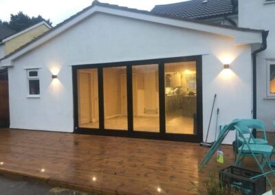 The back of a house with bifolding doors